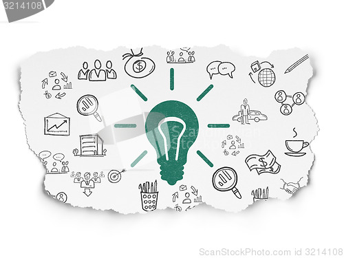 Image of Finance concept: Light Bulb on Torn Paper background