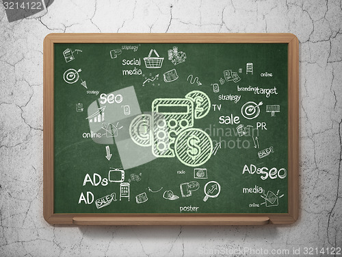 Image of Marketing concept: Calculator on School Board background