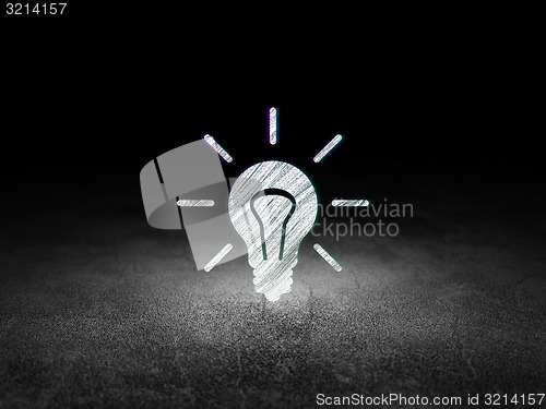 Image of Business concept: Light Bulb in grunge dark room