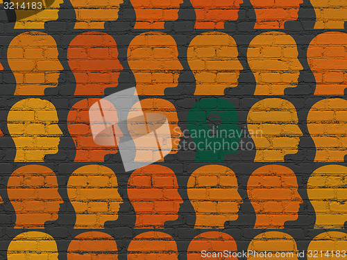 Image of Finance concept: head with light bulb icon on wall background