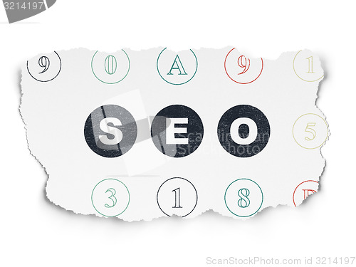 Image of Web design concept: SEO on Torn Paper background