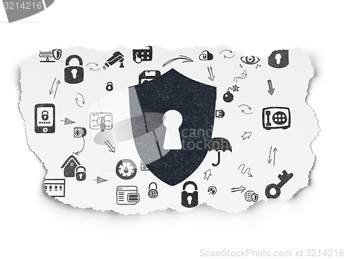 Image of Safety concept: Shield With Keyhole on Torn Paper background