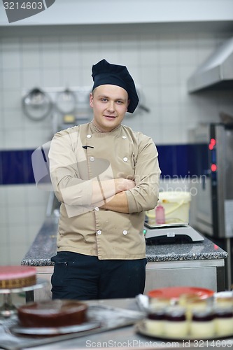 Image of chef preparing desert cake in the kitchen