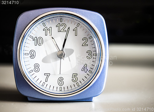 Image of Old fashioned azure morning alarm clock 