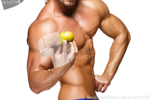 Image of Shaped and healthy body man holding a fresh apple fruit,  isolated on white background