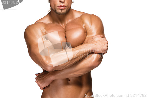 Image of Attractive male body builder on white background