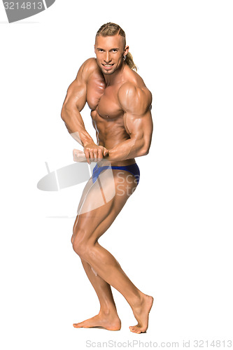 Image of Attractive male body builder on white background