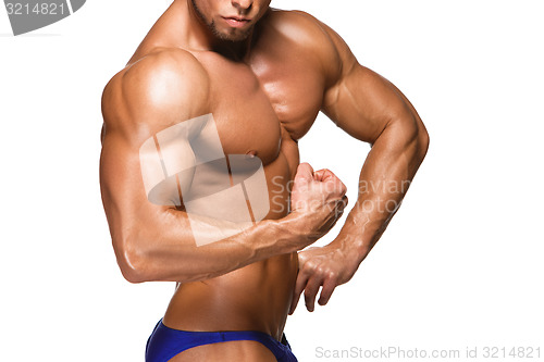 Image of Attractive male body builder on white background