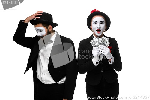 Image of memes as businesswoman and businessman counting money