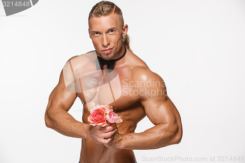 Image of the very muscular handsome sexy guy on white background, naked  torso