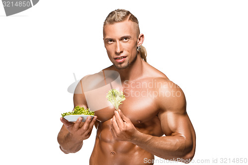 Image of Shaped and healthy body man holding a fresh lettuce,  isolated on white background