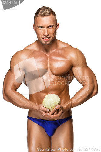 Image of Shaped and healthy body man holding a fresh cabbage ,  isolated on white background