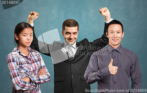 Image of Asian team and businessman with hands up