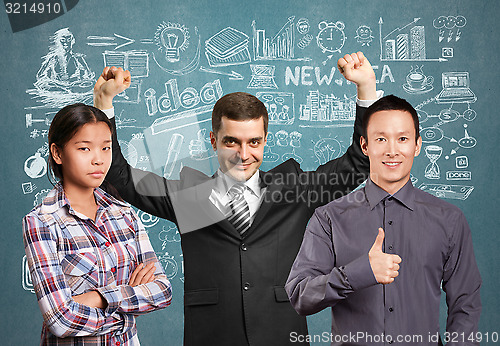 Image of Asian team and businessman with hands up