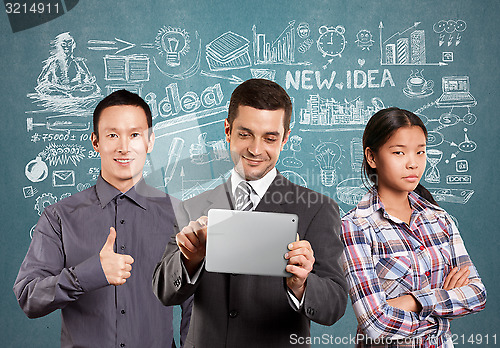 Image of Asian team and Businessman With Touch Pad