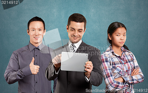 Image of Asian team and Businessman With Touch Pad