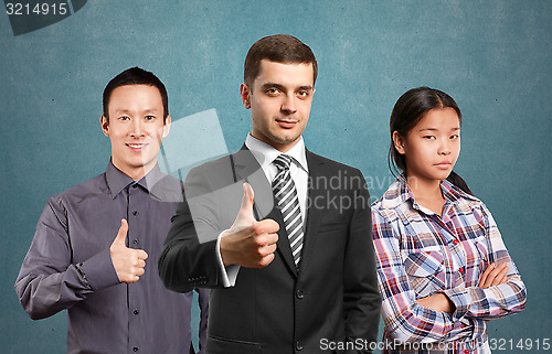 Image of Asian team and lamp head business people with laptops