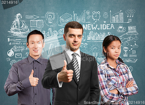 Image of Asian team and lamp head business people with laptops