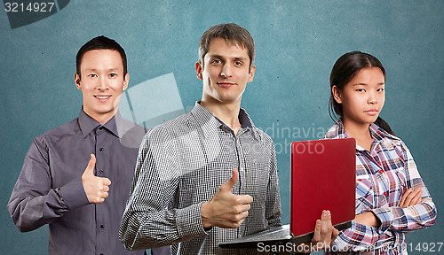 Image of Asian team and man with laptop in his hands and woman