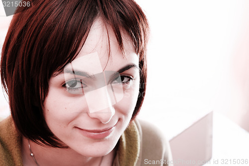 Image of Young woman in bed