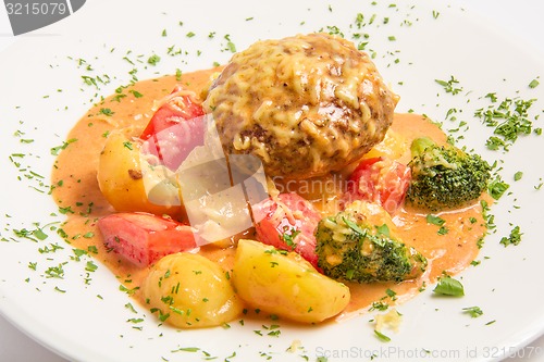 Image of klops of veal with bacon, capers, grated cheese in a creamy sauce 