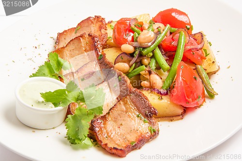 Image of ham with roasted vegetables