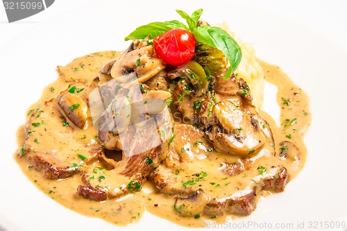 Image of meat with mushroom cream sauce