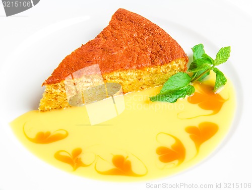 Image of Piece of cake with yellow sauce