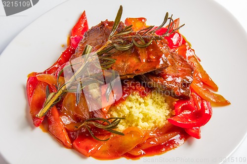 Image of Couscous with lamb in sweet and sour tomato sauce.