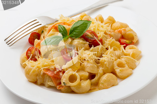 Image of Cream and tomato pasta with fork