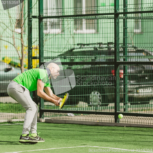 Image of man play tennis outdoor