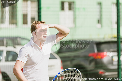 Image of man play tennis outdoor