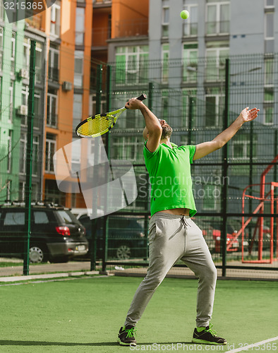 Image of man play tennis outdoor