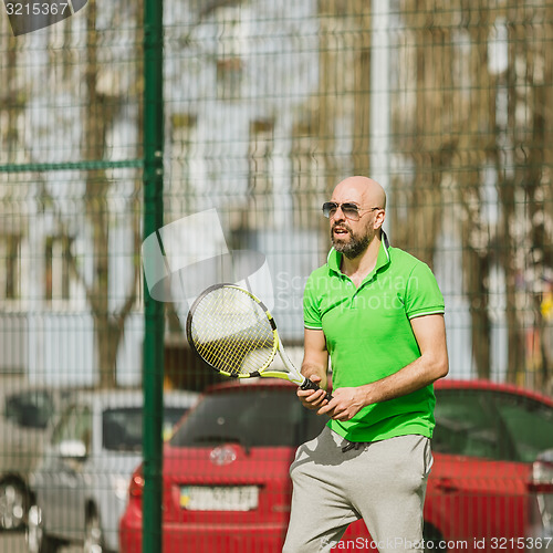 Image of man play tennis outdoor