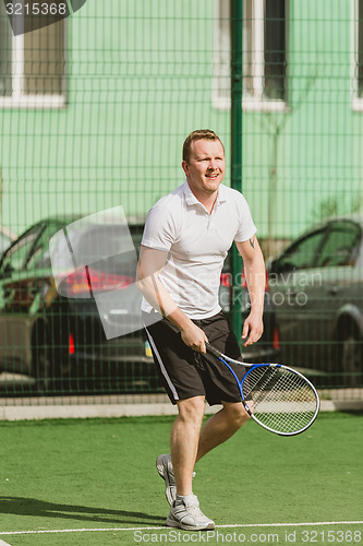 Image of man play tennis outdoor