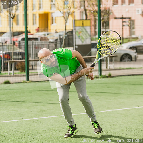 Image of man play tennis outdoor