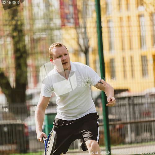 Image of man play tennis outdoor