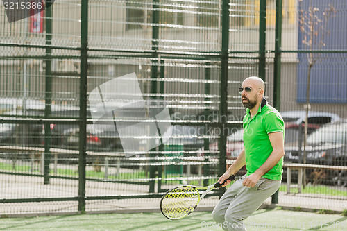 Image of man play tennis outdoor