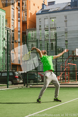 Image of man play tennis outdoor