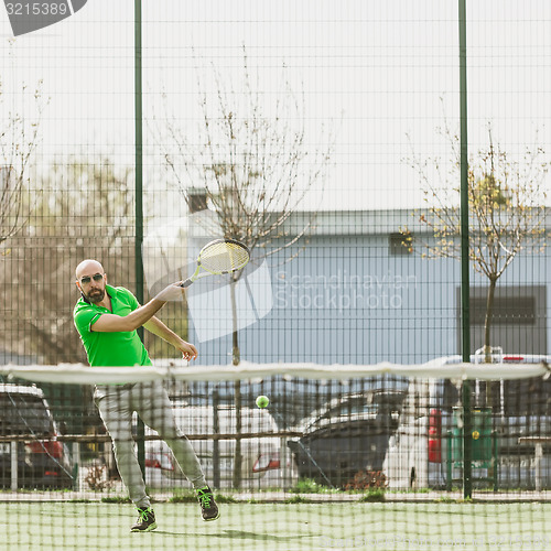 Image of man play tennis outdoor