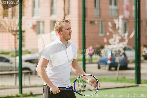 Image of man play tennis outdoor