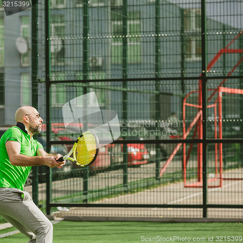 Image of man play tennis outdoor