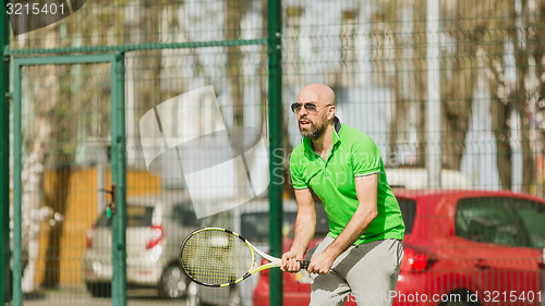 Image of man play tennis outdoor