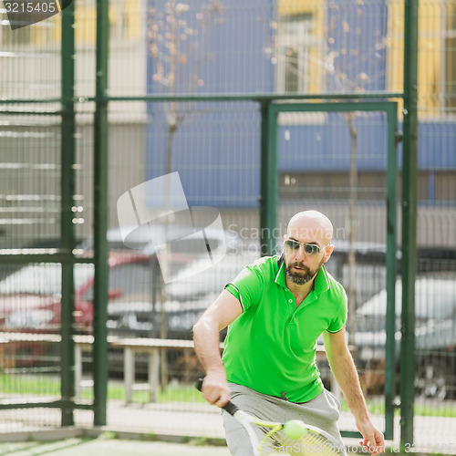 Image of man play tennis outdoor