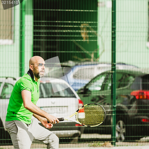 Image of man play tennis outdoor