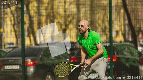 Image of man play tennis outdoor