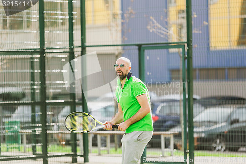 Image of man play tennis outdoor