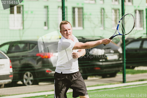 Image of man play tennis outdoor