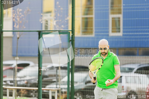 Image of man play tennis outdoor