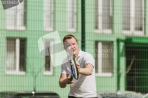 Image of man play tennis outdoor
